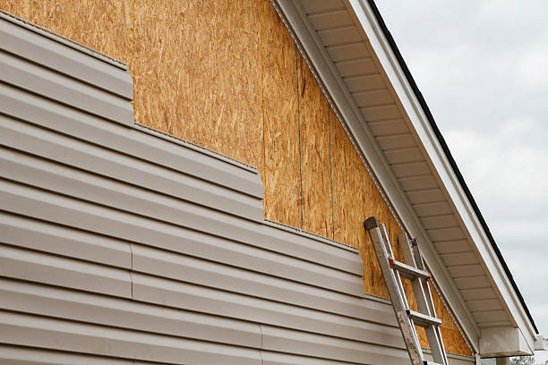 Professional Siding Contractor technician working in Harwick, PA